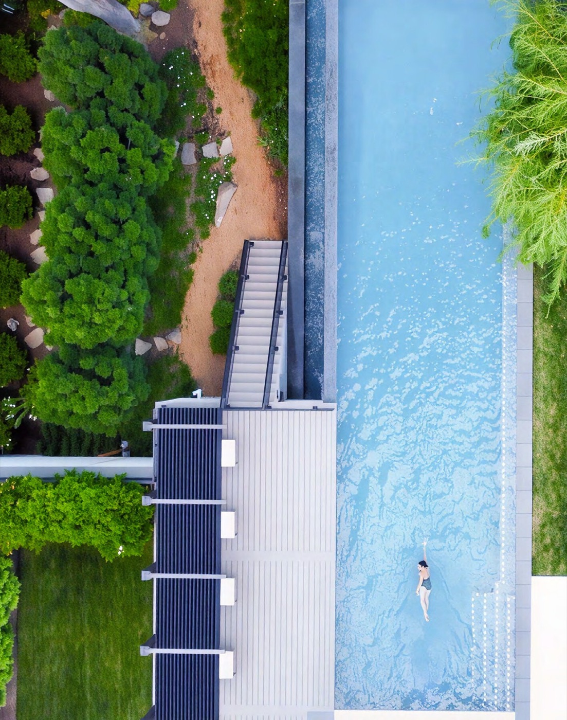 Landscaped courtyard and pool deck at a luxury apartment property